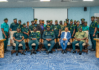 Faisal Disu (M) with other officials at the opening of a two-day training session on E-Visa