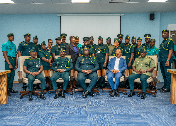Faisal Disu (M) with other officials at the opening of a two-day training session on E-Visa