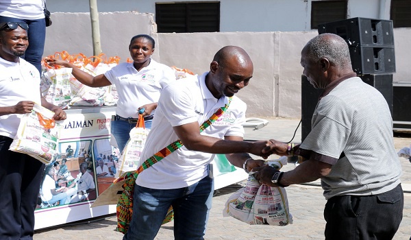 Project Caucus representatives present packages to aged people