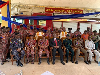 Joe Ghartey (suit) in a group picture with some fire service officers