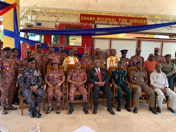 Joe Ghartey (suit) in a group picture with some fire service officers