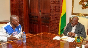National Chairman of the GPRTU, Kwame Kuma interacts with President Akufo-Addo.