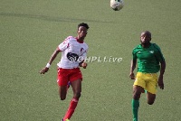 Richmond Lamptey and Sam Adams in a battle for the ball