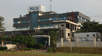 A man walks past a hospital in Abuja, Nigeria, Wednesday