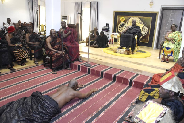 Benkumhene Nana Boakye Darkwa lying prostrate before the Okyenhene