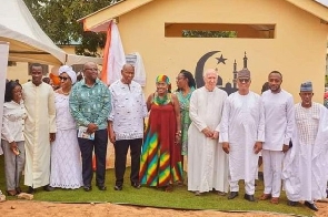 Father Andrew Campbell (in with cassock) with other dignitaries at the commissioning of the mosque