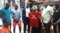 Stephen Appiah with his team at the Adidas office