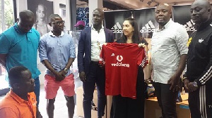 Stephen Appiah with his team at the Adidas office