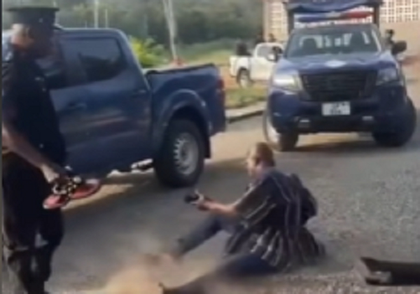 Kwahumanhene Daasebre Akuamoah Boateng III lamenting while sitting on the ground