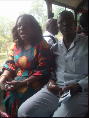 Catherine Abelema Afeku and Nsien SHS Headmaster Aboagye Mochiah seating in the bus she donated