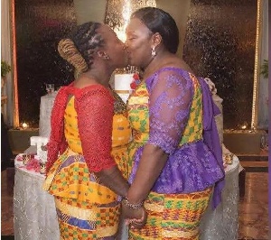 Ghanaian lesbians seen kissing during their wedding ceremony in the Netherlands