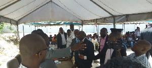 Vice President Dr. Mahamudu Bawuma interacting with others at the Passport Office in Accra