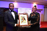 Antoinette Kwofie, Chief Finance Officer of MTN Ghana [R] receiving a certificate