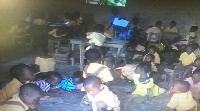 Gomoa Manpong primary school pupils sitting on the floor to study