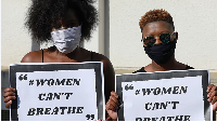 Activists, wearing masks to protect themselves from the coronavirus, protest in SA, June 2020