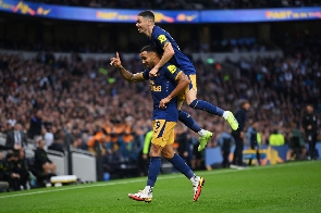 Newcastle players celebrate as dem score against Tottenham