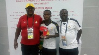 Emmanuel Toku (middle) with some officials after the match