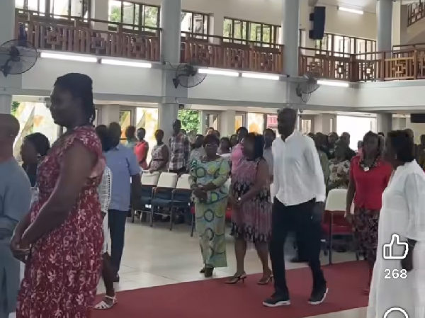 Otto Addo (in black and white attire) was seen walking to the altar