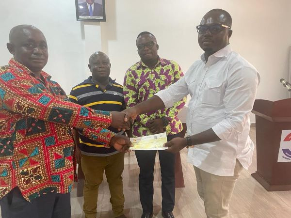 Francis Owusu Akyaw submitting his bank draft at the party office in Juaben