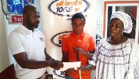 Blind student Alhasan sadwiched by mother and Ultimate FM staff