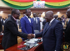 Alban Bagbin exchanges pleasantries with President Akufo-Addo in Parliament