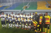 Paa Kwesi Fabin [black] with his team