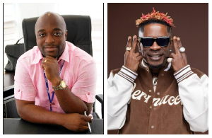 Kofi Abban (L) gifts Shatta Wale (R) a black Ferrari