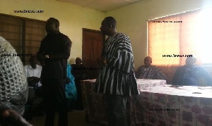 Minister of State Bryan Acheampong (L) tried to convince the NPP members to accept the new MCE