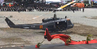The helicopter landed forcefully causing the red carpet to scatter due to the impact