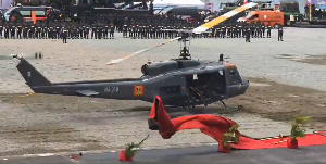 The helicopter landed forcefully causing the red carpet to scatter due to the impact