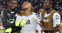 Asamoah Gyan and Fatau Dauda console Andre Ayew, after Ghana lost the finals of the 2015 AFCON
