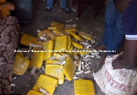 The 44 slabs of illegal drugs being removed from a sack of dried cassava