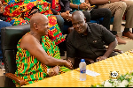 Wisdom Dogbey (R)  greeting Togbe Afede XIV (L)