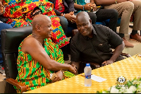 Wisdom Dogbey (R)  greeting Togbe Afede XIV (L)