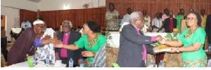 Charlotte Osei in an handshake with Sheikh Larry and Rev. Prof. Emmanuel Martey