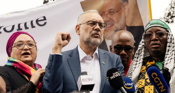 South Africa's expelled ambassador to the United States Ebrahim Rasool addresses supporters