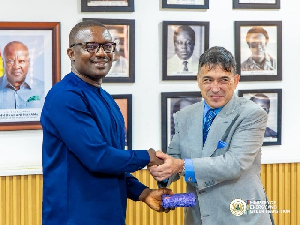 Energy minister (L) shaking hands with a member of AJC after the meeting