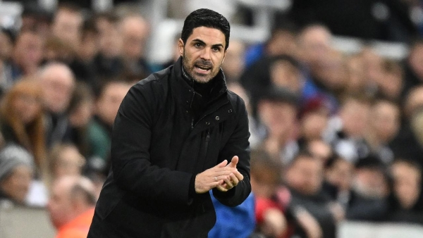 Arsenal's Spanish manager Mikel Arteta applauds fans on the pitch after the English Premier League