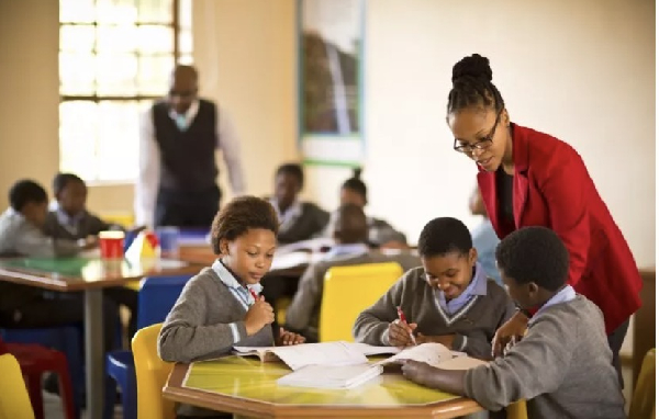 Picture of students in class with a teacher