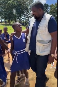 John Dumelo interacting with some pupils in Assin North ahead of the by-election