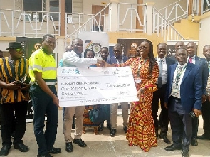 Rita Akosua Dickson receiving the cheque