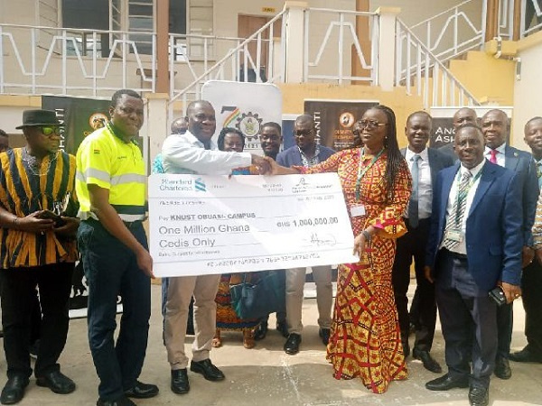 Rita Akosua Dickson receiving the cheque