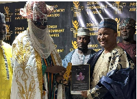 Alhaji Issaka Nii Nertey Nettey (right) seen receiving his award