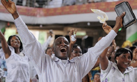 Christians in church in a state of worship