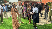 Prince Harry, Duke of Sussex and his wife Meghan, Duchess of Sussex, arrive to meet students