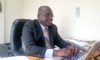 Managing Director of Adehyeman Savings and Loans, Mr Joe Emmim