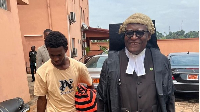 Junior Ngombe with lawyer Akere Muna in Yaoundé