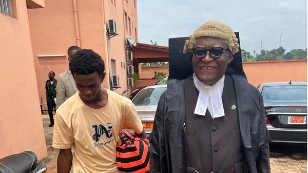 Junior Ngombe with lawyer Akere Muna in Yaoundé