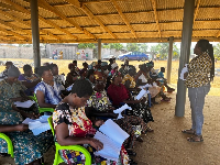 A picture of the caregivers receiving training