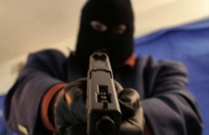 File photo of an armed robber with a gun